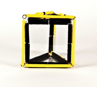 Photo shows a triangular prism constructed from Geometro tiles with the corresponding rod model placed over it, in Position 1, with a square face in front, vertical, and parallel to the viewer.