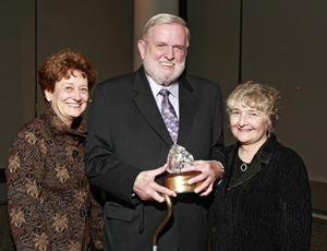 Phil Hatlen holding his Wings of Freedom Award, Patricia Williams of the Hatlen Center (left) and Betsy Wada.