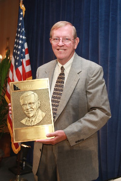 Richard Welsh poses with his plaque after his induction in 2008