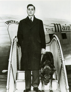 Morris Frank and Buddy exit from an airplane