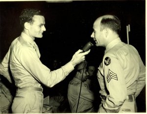 Warren Bledsoe in U.S./Army Air Corps uniform being interviewed by another soldier, ca. 1943