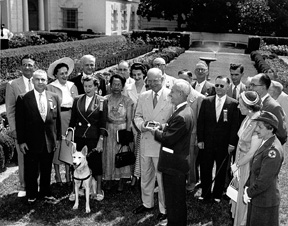 President Dwight D. Eisenhower is shown with Roy Kumpe in the White House Rose Garden.