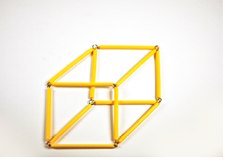 Photo shows the rod model of the square prism (cube) in 2-D.
