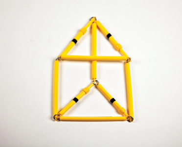Photo shows the rod model of the triangular prism in 2-D, straight on view, with variable length edges shortened.