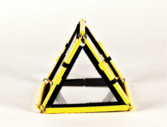 Photo shows a triangular prism constructed from Geometro tiles with the corresponding rod model placed over it, in Position 3, with the two triangular faces vertical and facing the viewer.