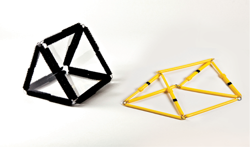 Photo shows a triangular prism constructed from Geometro tiles standing beside the corresponding rod model, now in 2-D, in Position 3, as viewed from the right.