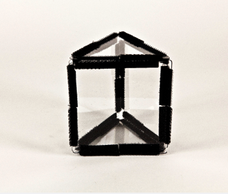 Photo shows a triangular prism constructed from Geometro tiles, Position 1.