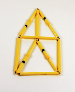 Photo shows the rod model of the triangular prism in 2-D, without changes in the length of the rods, as described.