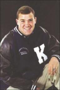 Travis wearing his University of Kentucky letter jacket.