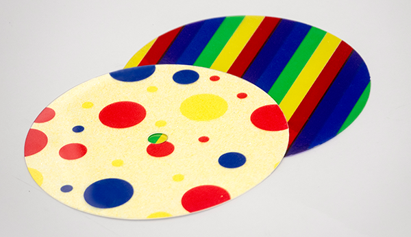Photograph of a multicolor striped overlay and a multicolor dot overlay.