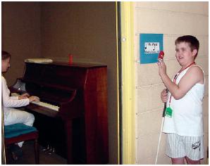 Student arriving at music class (Learner's music card matches tactile card mounted outside the music classroom.)