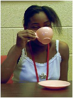 Learner drinks hot tea.