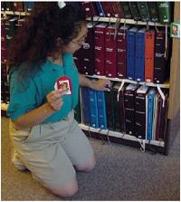Learner exploring books in library setting