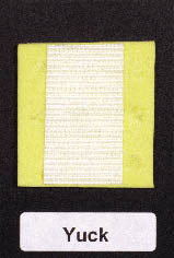 Hooked hook and loop piece and square piece of yellow craft foam adhered to the card