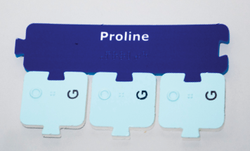 Photograph of a Proline amino acid subunit attached to three G tRNA nucleotide subunits