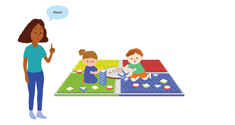 Two students sit on the sensory play mat. The teacher has a speech bubble beside her that says, Wave! The students are stacking the appropriate sensory tile.