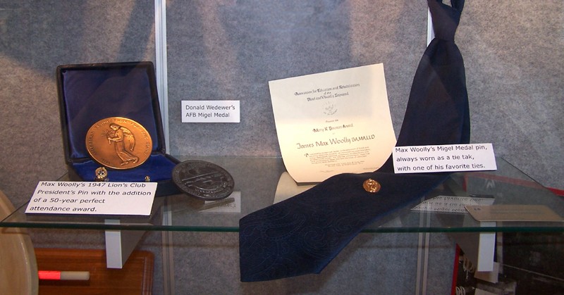 A close-up of some of the memorabilia--Max Woolly's 1947 Lion's Club President's Pin with a 50-year perfect attendance award, Donald Wedewer's AFB Migel Medal, and Max Woolly's Migel Medal pin (always worn as a tie tak) with one of his favorite ties