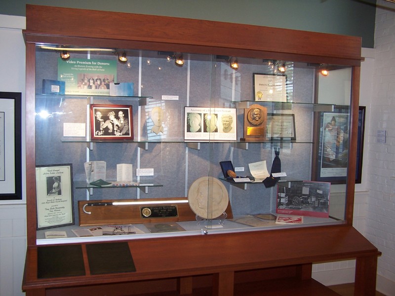 Display case containing relics and memorabilia of Hall of Fame inductees