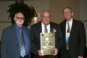 Bill English, center, with his Hall of Fame Plaque, and APH staffers Burt Boyer, left, and Will Evans, right
