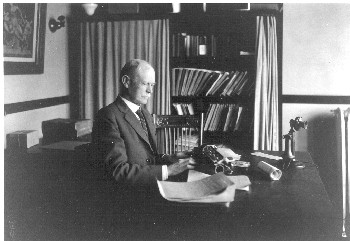 William Hadley sitting at his desk