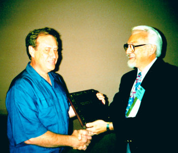 Accepting an award from Bruce Blasch