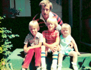 On his parent's front porch with his 3 kids--Marc, David & Alicia