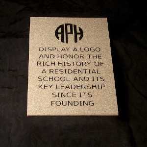 Sample stone with APH logo and this engraved text: "Display a logo and honor the rich history of a residential school and its key leadership since its founding"