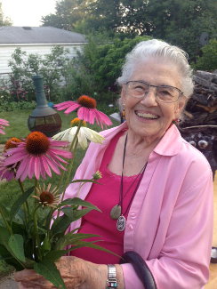 Alice smiling with flowers