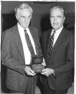Russell Williams receiving the Migel Medal from Jack S. Crowley