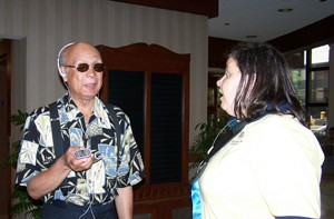 Jimmy Carter of the Blind Boys of Alabama tries out a K-Sonar with a little help from APH's Terrie Terlau