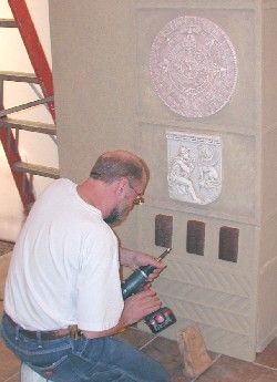 Installer Steve Forrester from Nashville works on the museum's new entry portal.