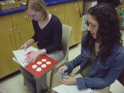 Audience members interacting with games at the presentation.