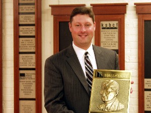 Jeff Johnson holding the Robert Irwin Hall of Fame Plaque