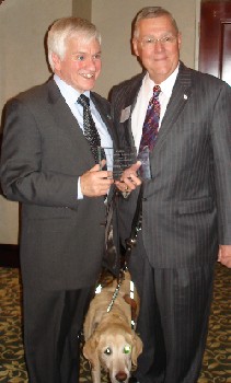 Gary Mudd accepts the award from Dick Thornton