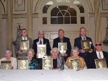 Nine Living Legends--(left to right) Ruth Kaarlela, Samuel Ashcroft, Natalie Barraga, Cleo Dolan, Eleanor Faye, Louis Vieceli, Alice Raftary, Stanley Suterko, and Donald Wedewer-- pose with their Hall of Fame Plaques. Click on this picture to see more pictures from the event.