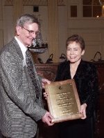 Sally Mangold accepts her award from APH's Will Evans