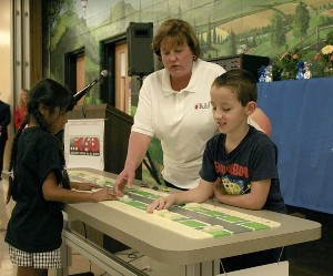 KSB students Annmarie Aqua (left) and Justin Hedges (right) demonstrating the map with KSB O&M Instructor Mary Pawlowski (center)