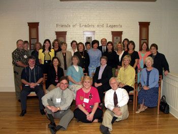 'Meeting of the Minds' participants pose in front ofthe Hall of Fame's Wall of Tribute