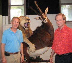 WSSB Superintendent Dean Stenehjem and APH President Tuck Tinsley stand in front of a safari exhibit at the school