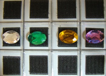 oval rhinestones attached to the Hundreds Board with VELCRO (r) brand