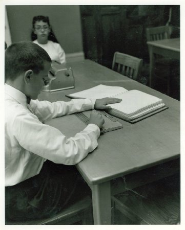 .2- Virgil Ritchie using a desk slate at KSB, November 1962