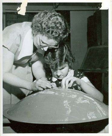 .13 -Student w/ globe, ca.1960