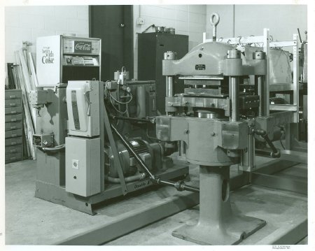 Press, at right, coupled to hydraulic power unit (.1d)