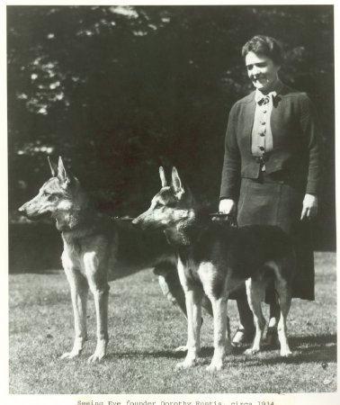 Dorothy Eustis with two German Shepherds