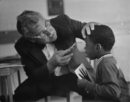 Dr. Hoover examining boy's eye
