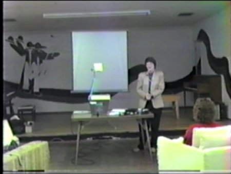 Screen grab, speaker with overhead projector