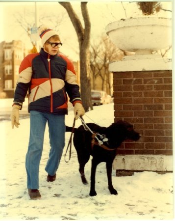 Man wearing Sonic Guide with dog guide
